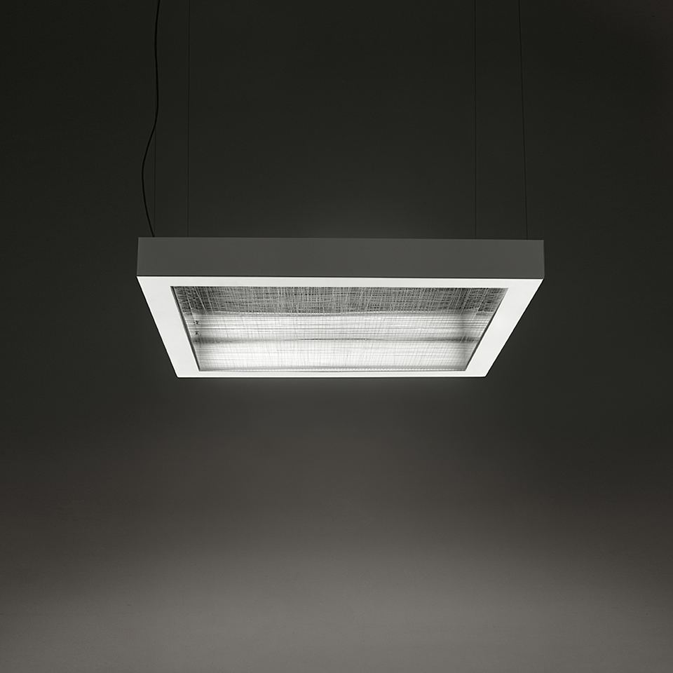 Artemide Altrove pendant lamp: rectangular dark grey frame with textured glass diffuser and fluorescent tubes, suspended by two cables
