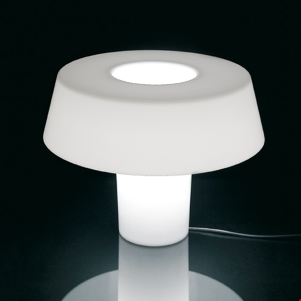 Artemide Amami table lamp: white diffused light through mushroom-shaped opal body with open top, glowing cylindrical base