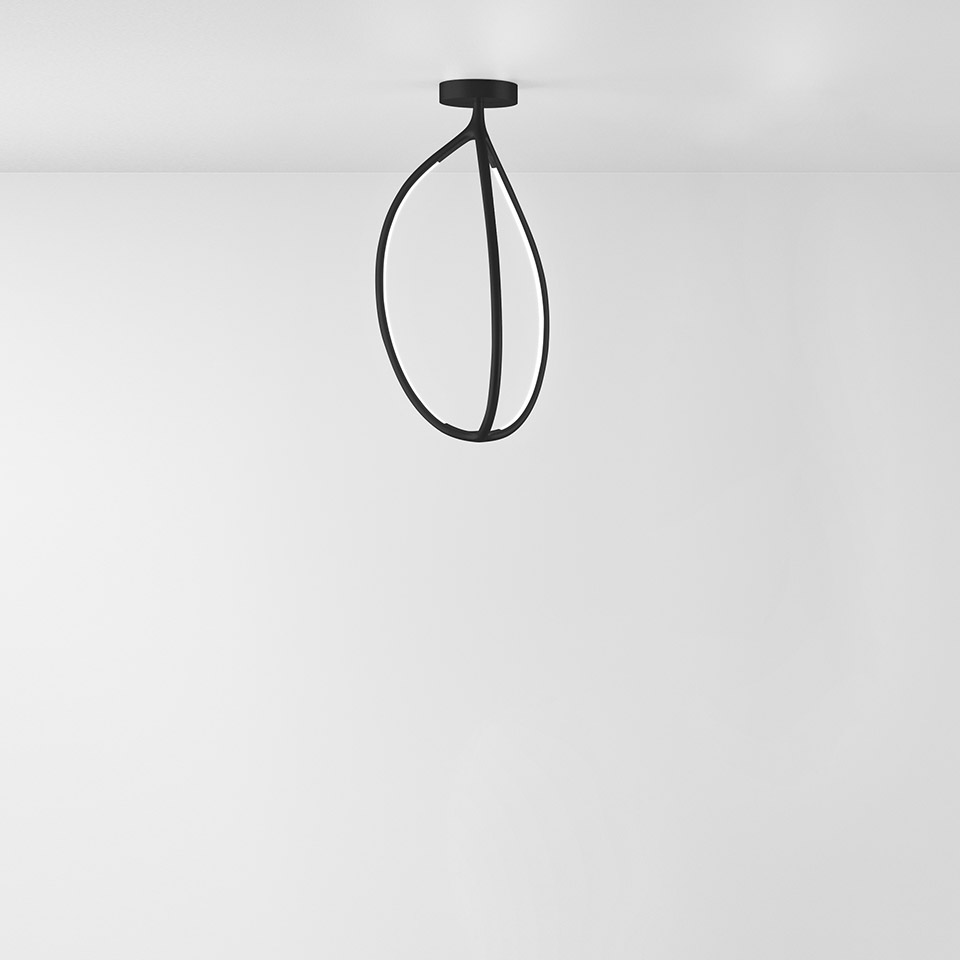 Artemide Arrival ceiling lamp: matte black sculptural drop-shaped metal frame, semi-flush mount on white ceiling