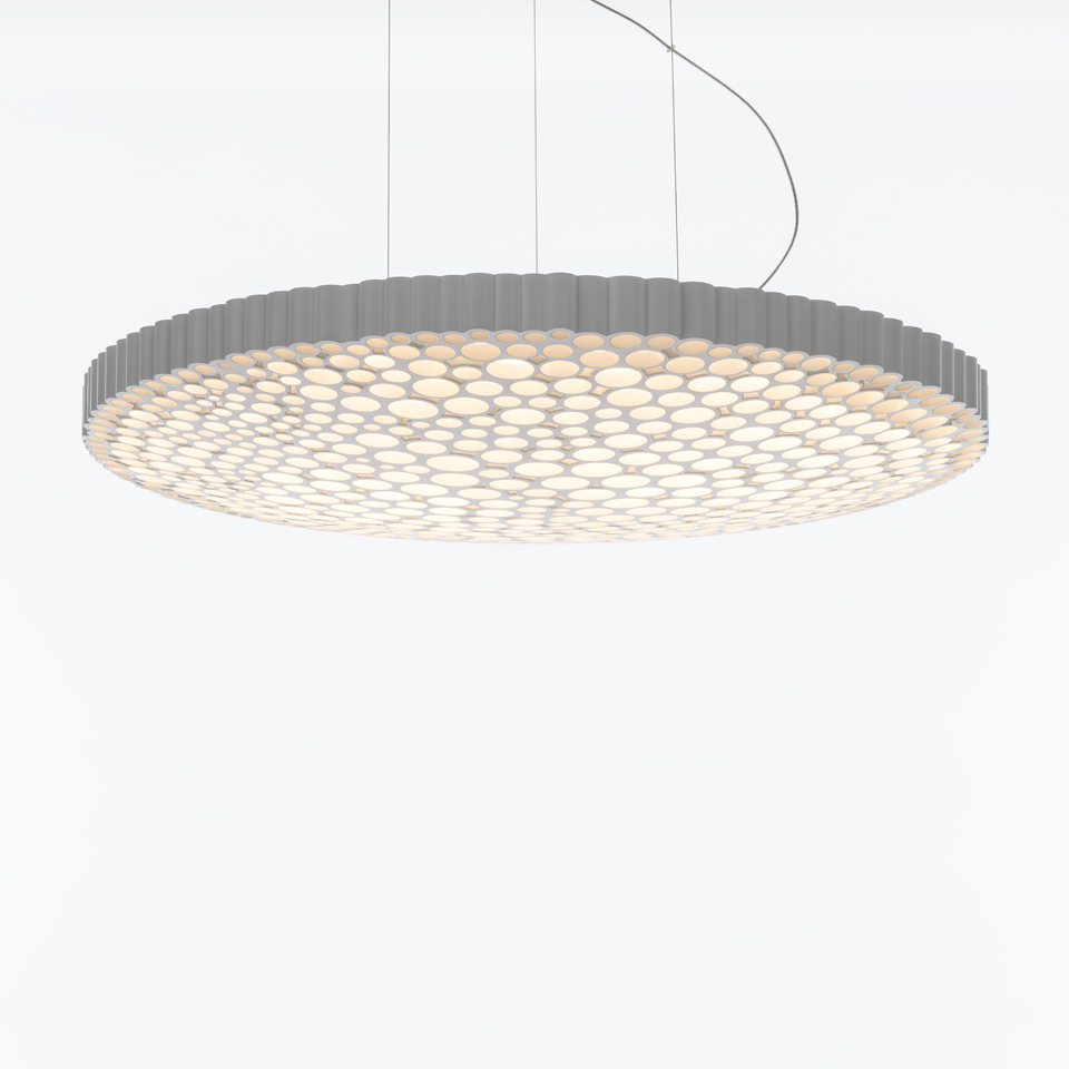 Artemide Calipso pendant lamp: large circular disc with honeycomb LED diffuser pattern, white finish, suspended by thin cables