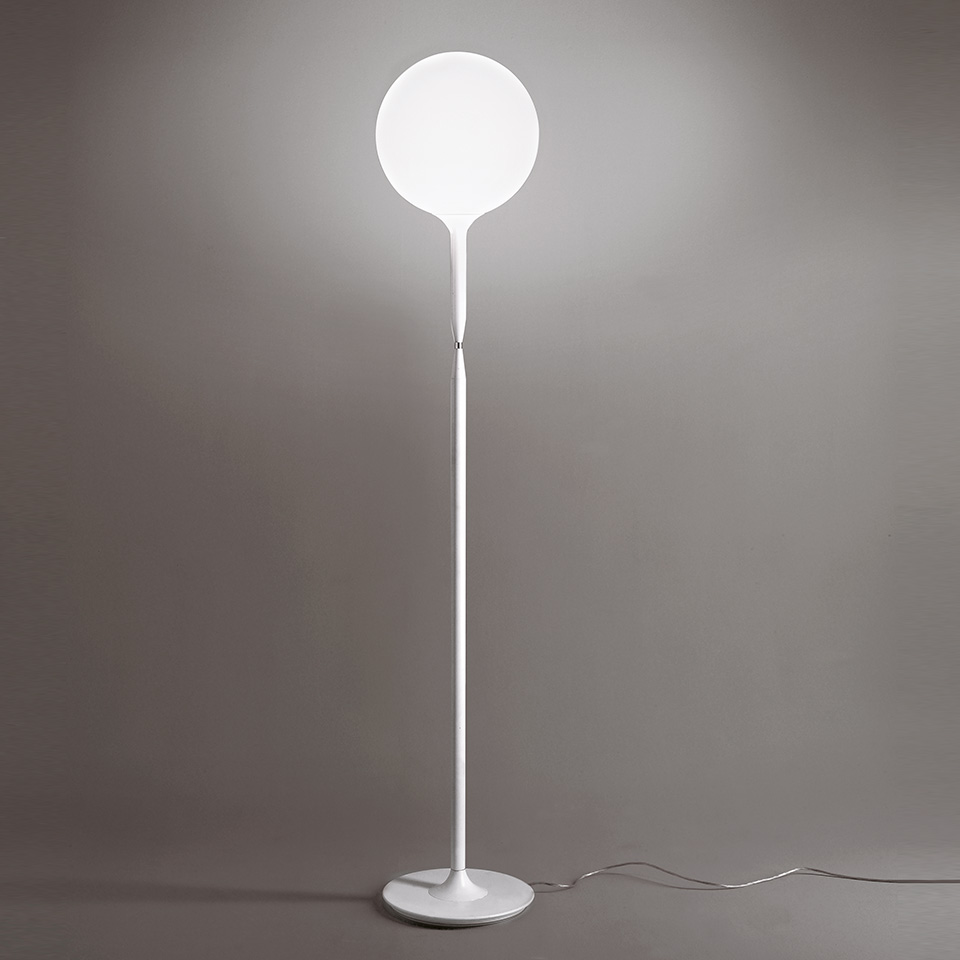Artemide Castore Terra floor lamp: slim white stem with round base, topped by a large opal white spherical glass diffuser