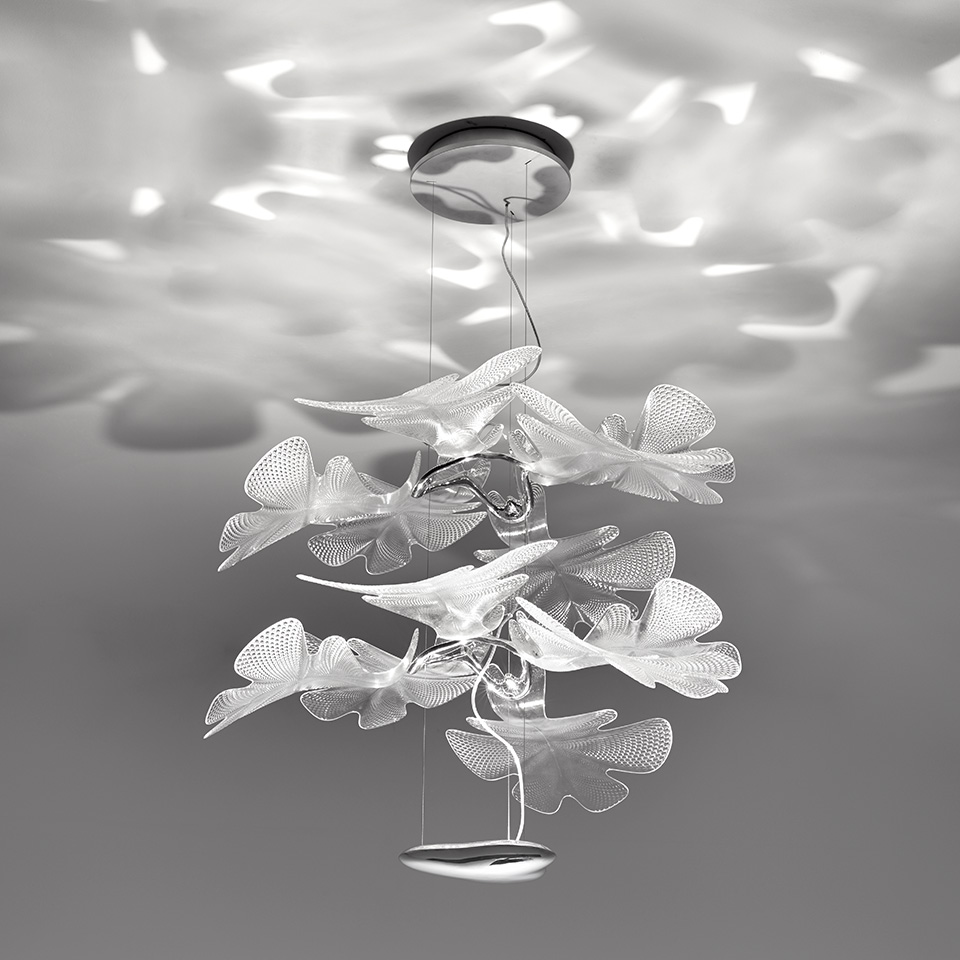 Artemide Chlorophilia 2 pendant lamp with layered translucent leaf-shaped diffusers casting organic light patterns on ceiling