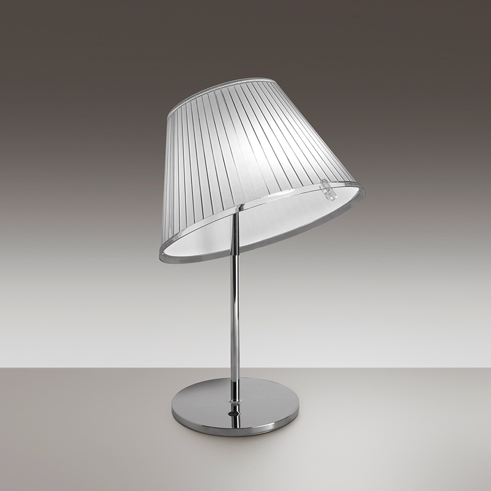 Artemide Choose table lamp with pleated transparent shade, chrome stem and circular base, tilted at an angle for directional light