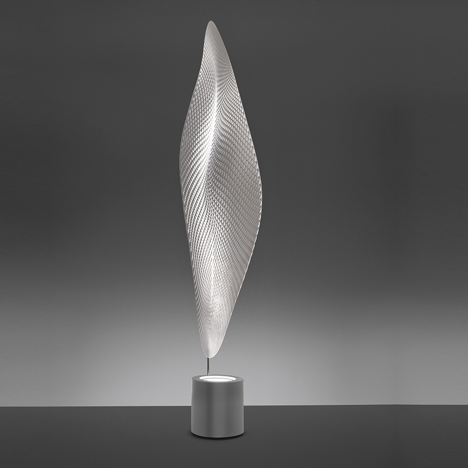 Artemide Cosmic Leaf floor lamp: tall silver leaf-shaped diffuser with textured mesh pattern on a cylindrical metallic base