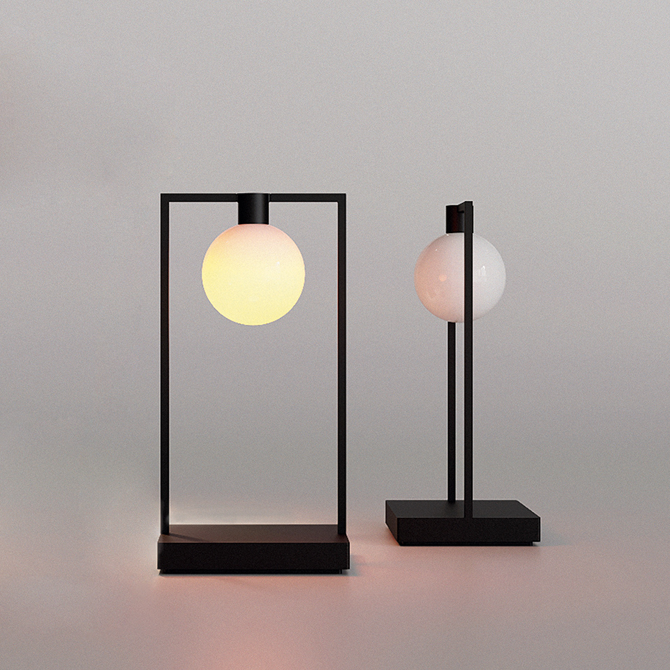 Two Artemide Curiosity table lamps: left rectangular black frame with glowing opal globe, right vertical stem with unlit opal globe on black base
