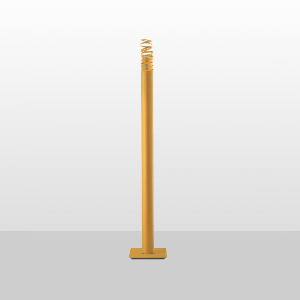 Artemide Decomposé Light Terra floor lamp: tall slim yellow-gold cylindrical stem with spiral coil diffuser at top, square base