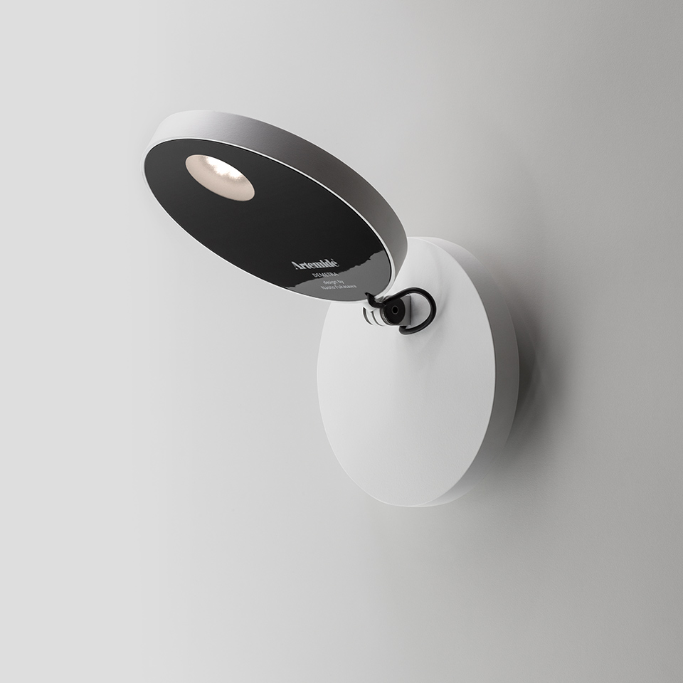 Artemide Demetra Faretto wall spotlight: white oval base, adjustable black circular head with integrated LED, designed by Naoto Fukasawa