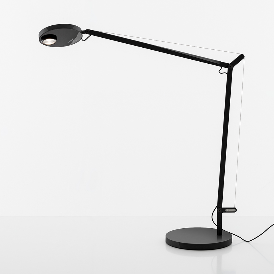 Artemide Demetra Professional desk lamp in black, featuring an adjustable articulated arm, circular LED head, and round base