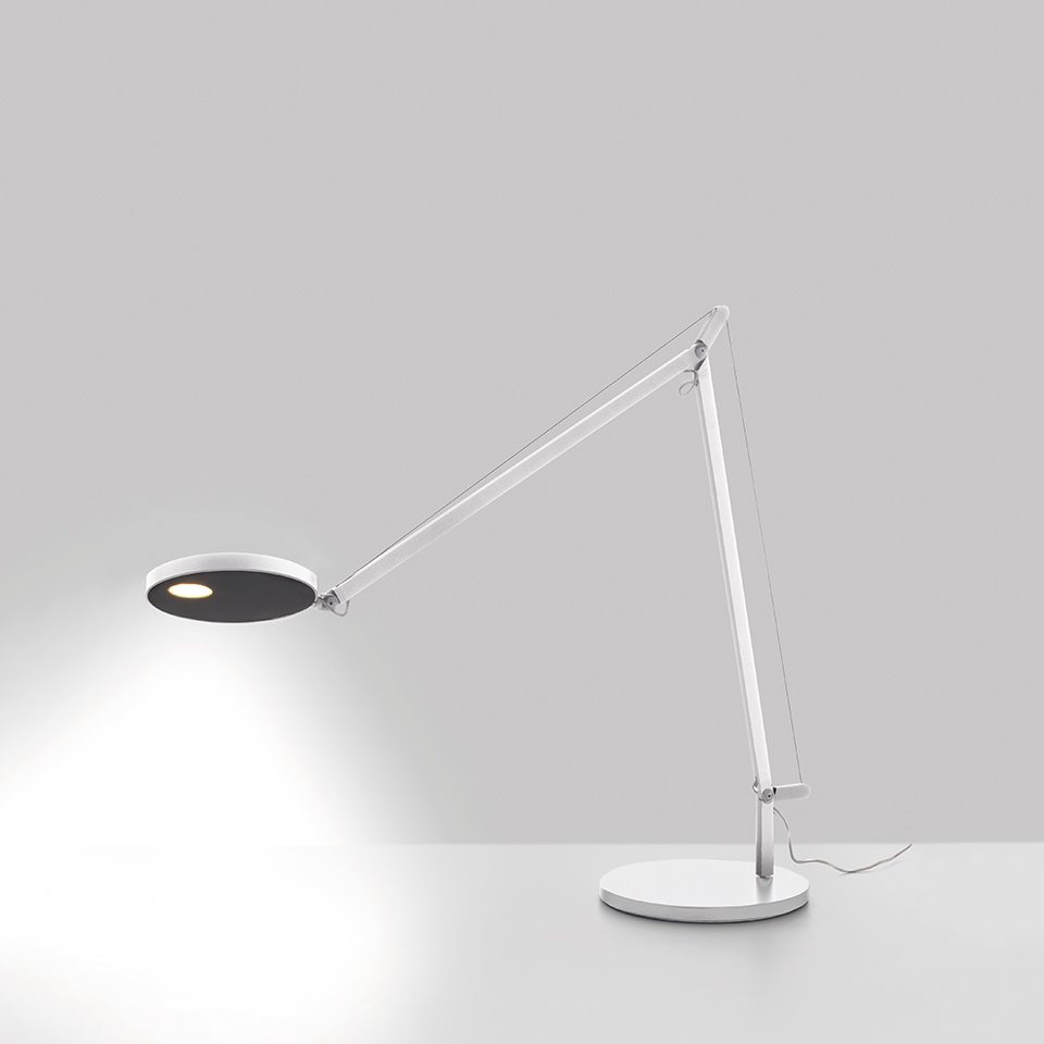 Artemide Demetra Tavolo desk lamp in white, with adjustable two-arm joint, circular LED head with dark reflector, casting focused light