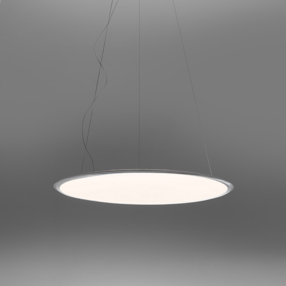 Artemide Discovery pendant lamp: large circular flat disc with white opal diffuser and slim aluminum frame, suspended by thin cables