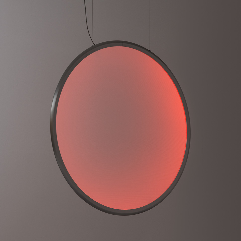 Artemide Discovery pendant lamp: large circular disc emitting warm red light, dark metal frame, suspended by a black cable - 2
