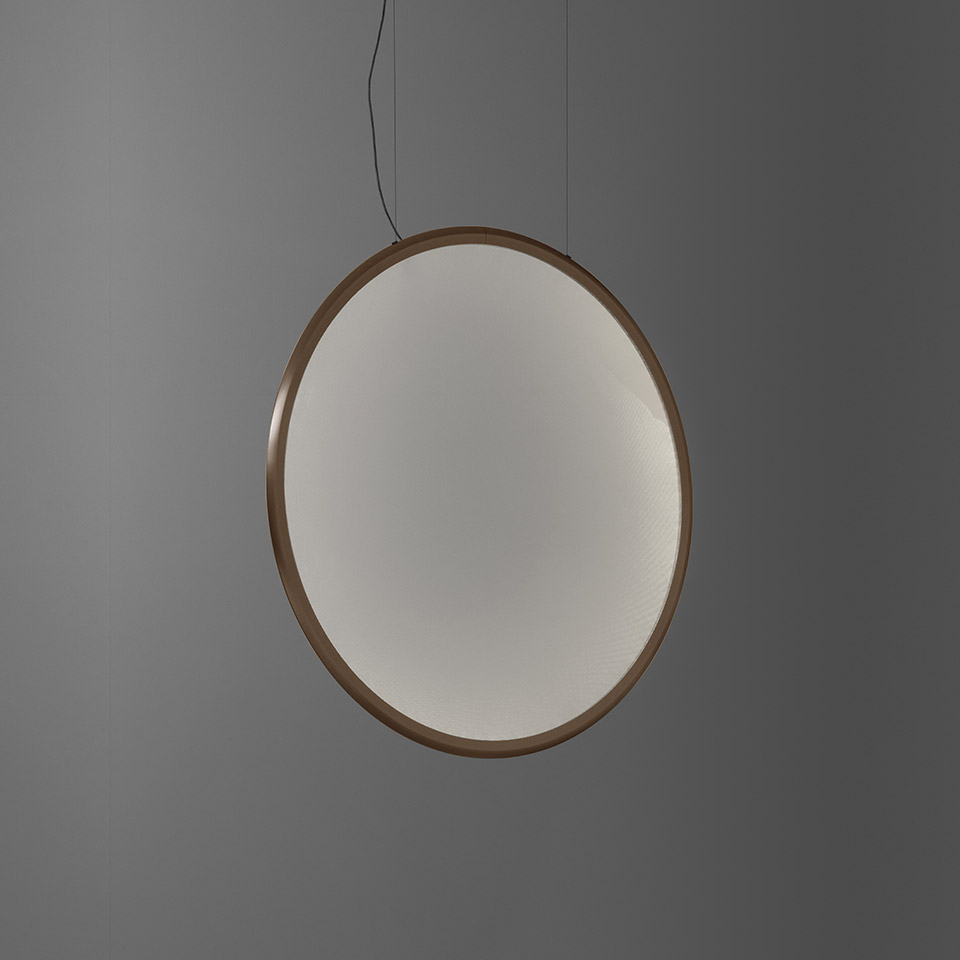 Artemide Discovery pendant lamp: large circular diffuser with warm bronze frame, emitting soft uniform white light, suspended by black cord - 2