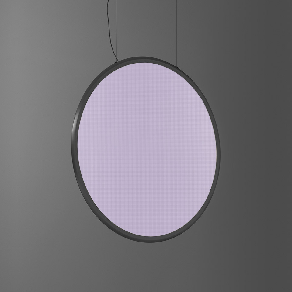 Artemide Discovery pendant lamp: large circular disc emitting soft lavender light, dark grey metal frame, suspended by thin cable