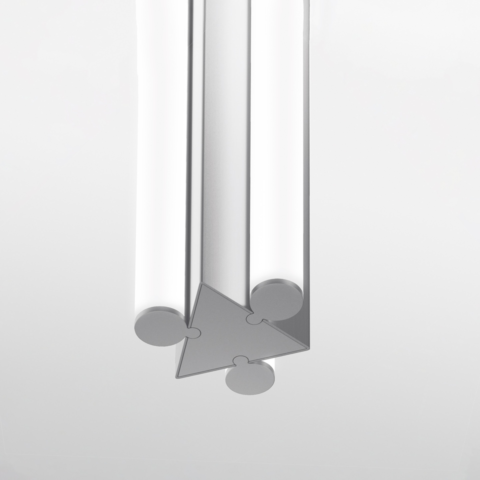 Dreispitz pendant lamp detail: three cylindrical opal tubes joined by a triangular aluminum connector with puzzle-like joints