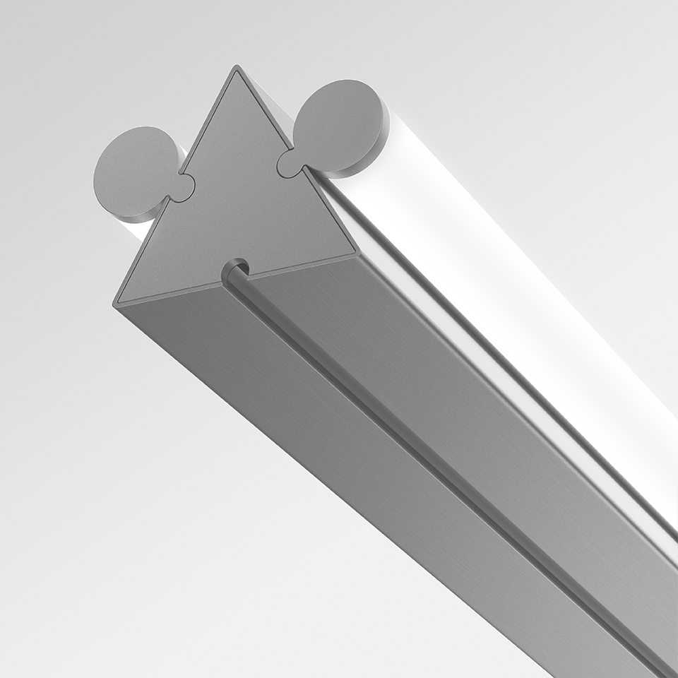Close-up of Artemide Dreispitz linear LED fixture showing triangular aluminum profile with diffuser and mounting connectors