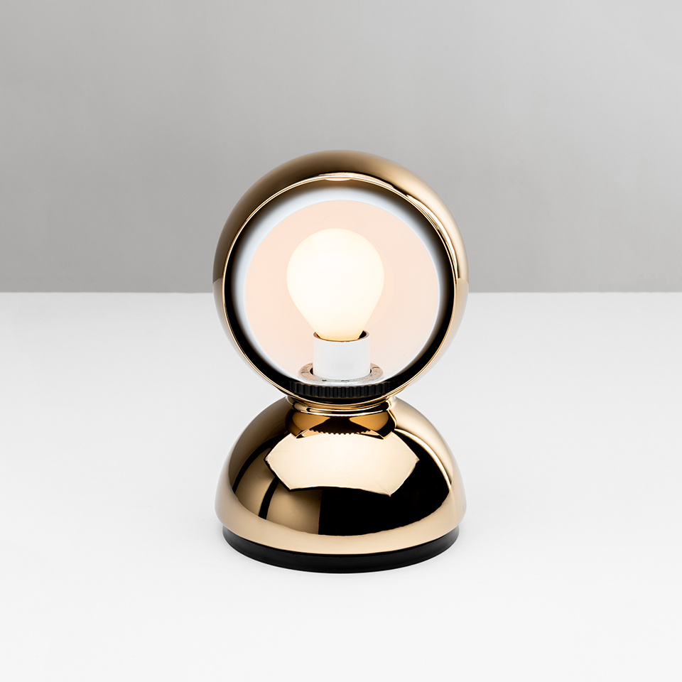 Artemide Eclisse table lamp in gold finish: circular halo frame with visible frosted bulb atop a rounded dome base - 2