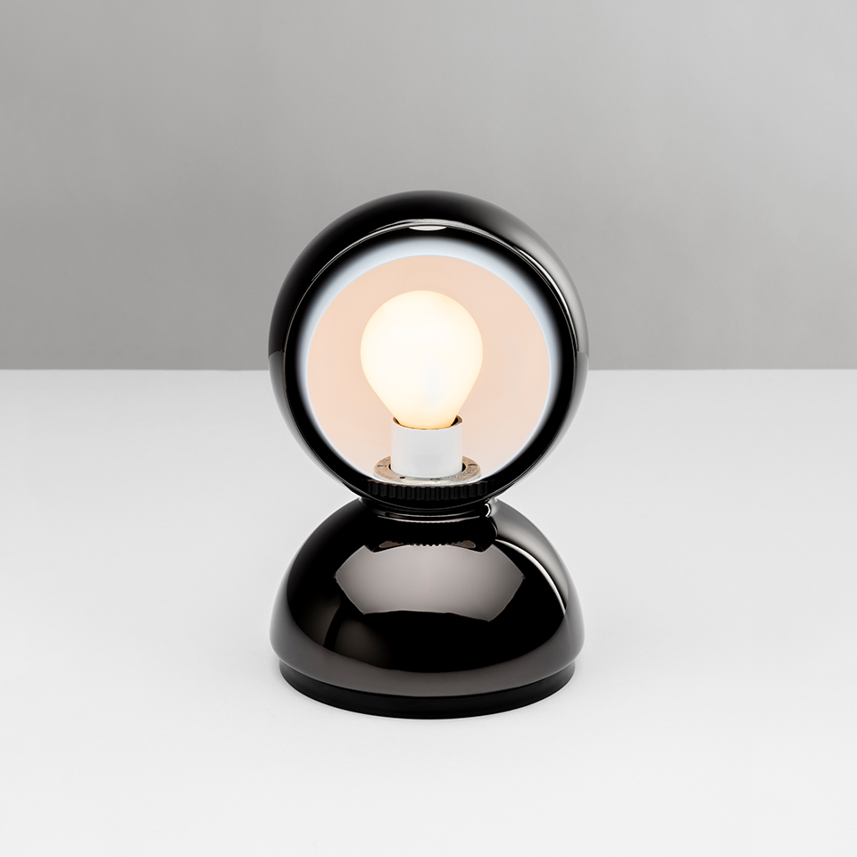 Artemide Eclisse table lamp in glossy black, featuring a rotating spherical shade revealing a frosted bulb on a dome-shaped base - 2