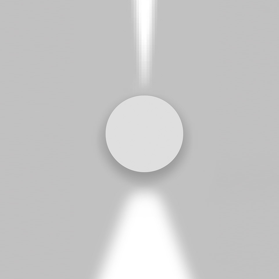 Artemide Effetto wall lamp, circular white body emitting focused light beams upward and downward against a grey wall