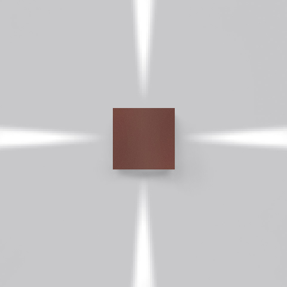 Artemide Effetto wall light in brown, emitting four directional beams of light upward, downward, and sideways on a grey wall