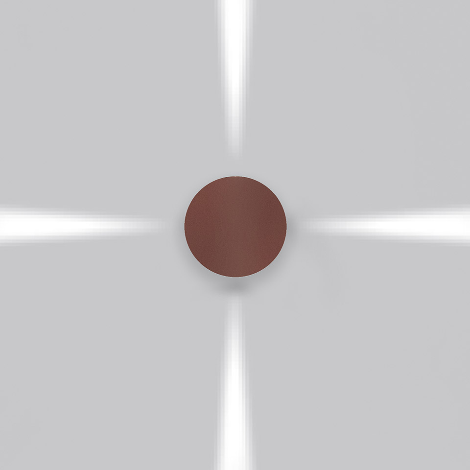 Artemide Effetto wall lamp with dark red circular diffuser emitting four directional light beams upward, downward, and sideways