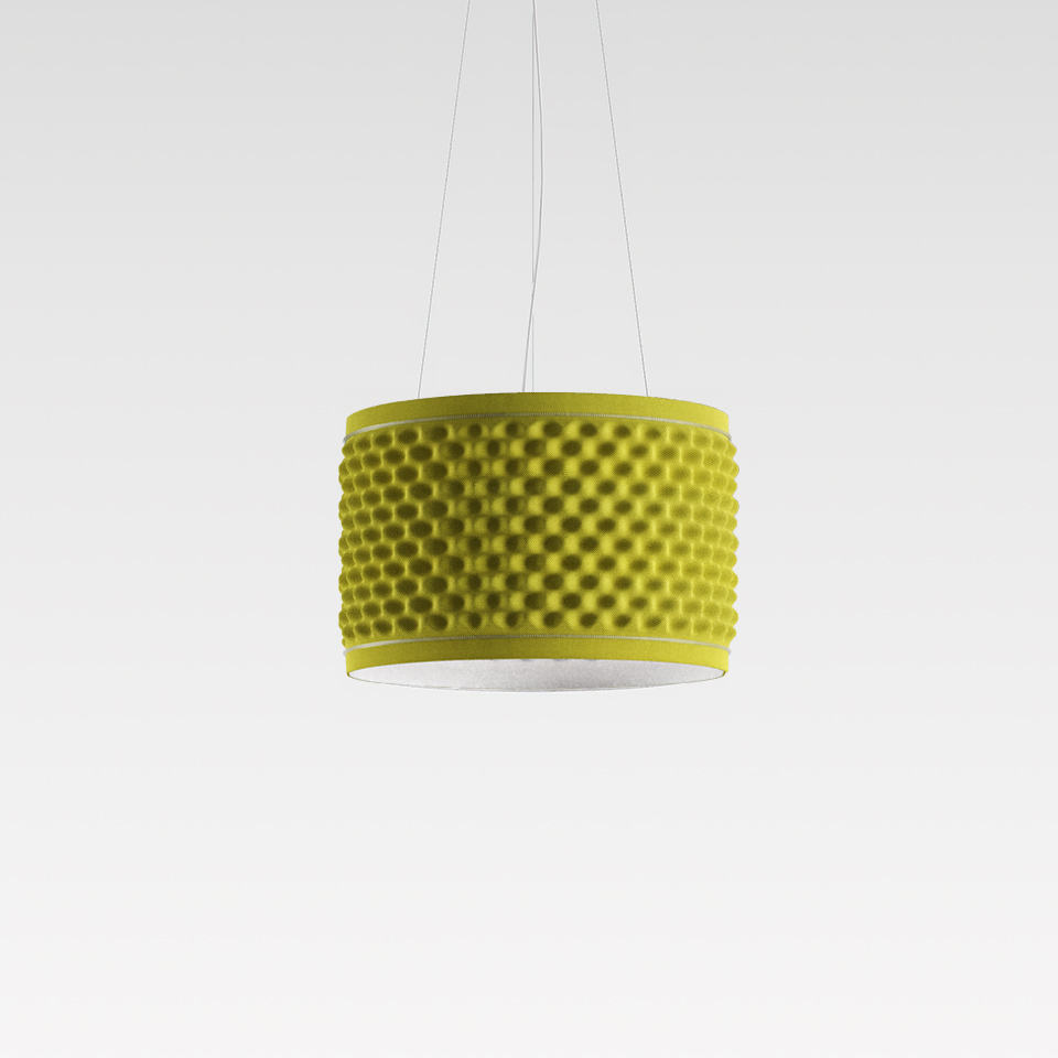 Artemide Eggboard Circle pendant lamp: yellow-green cylindrical shade with acoustic egg-crate foam texture, suspended by thin cables