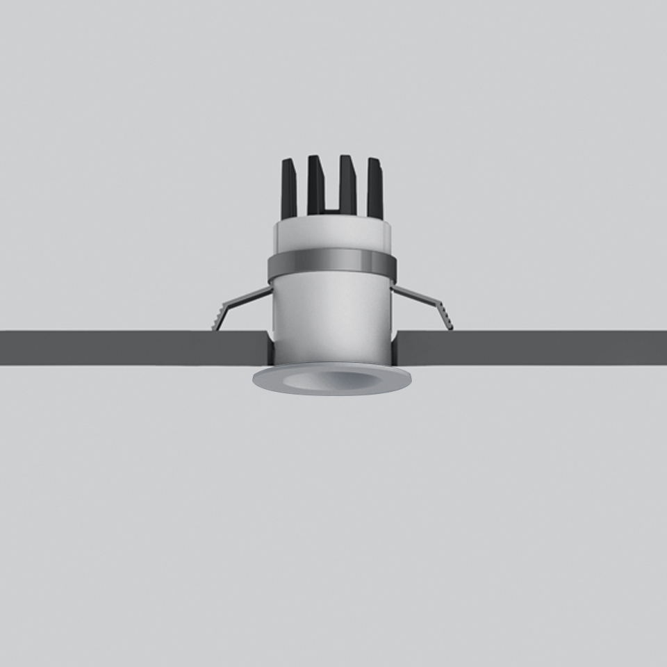 Artemide Everything 35 recessed LED downlight, compact round white fixture with heat sink fins, shown installed in ceiling