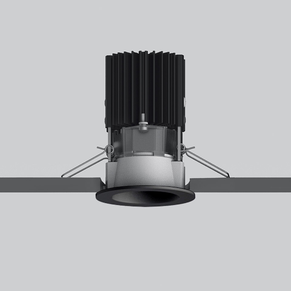 Artemide Everything 55 recessed LED downlight in black, with finned heat sink and spring-clip ceiling mounting system