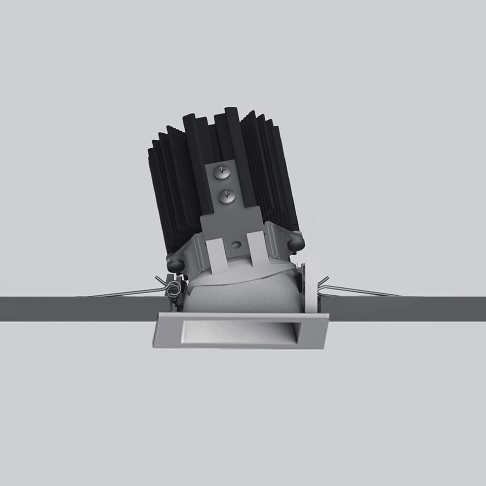 Artemide Everything 55 recessed spotlight with tilted LED module, square trim, heat sink fins, and spring clips for ceiling installation