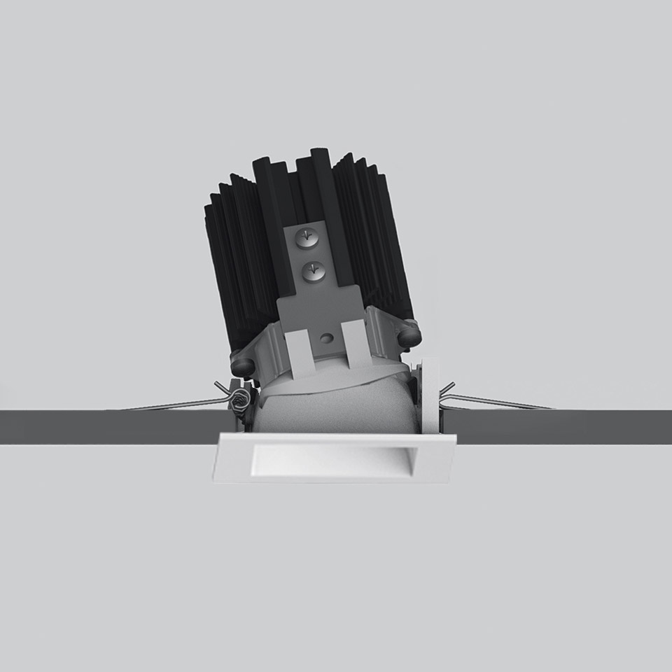 Artemide Everything 55 recessed spotlight, square trimless white frame, tilted LED module with black heat sink, shown during installation