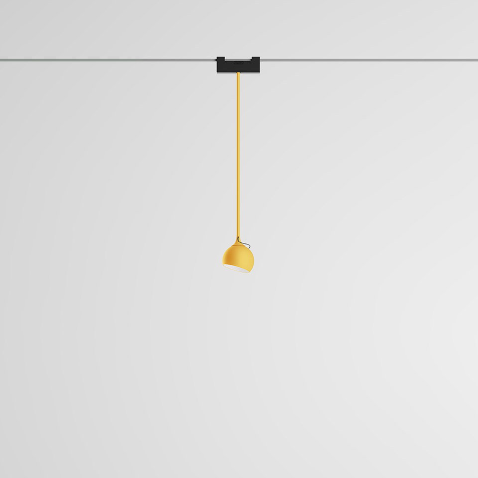 Artemide Funivia pendant lamp: yellow dome shade hanging from a black track rail via a yellow stem