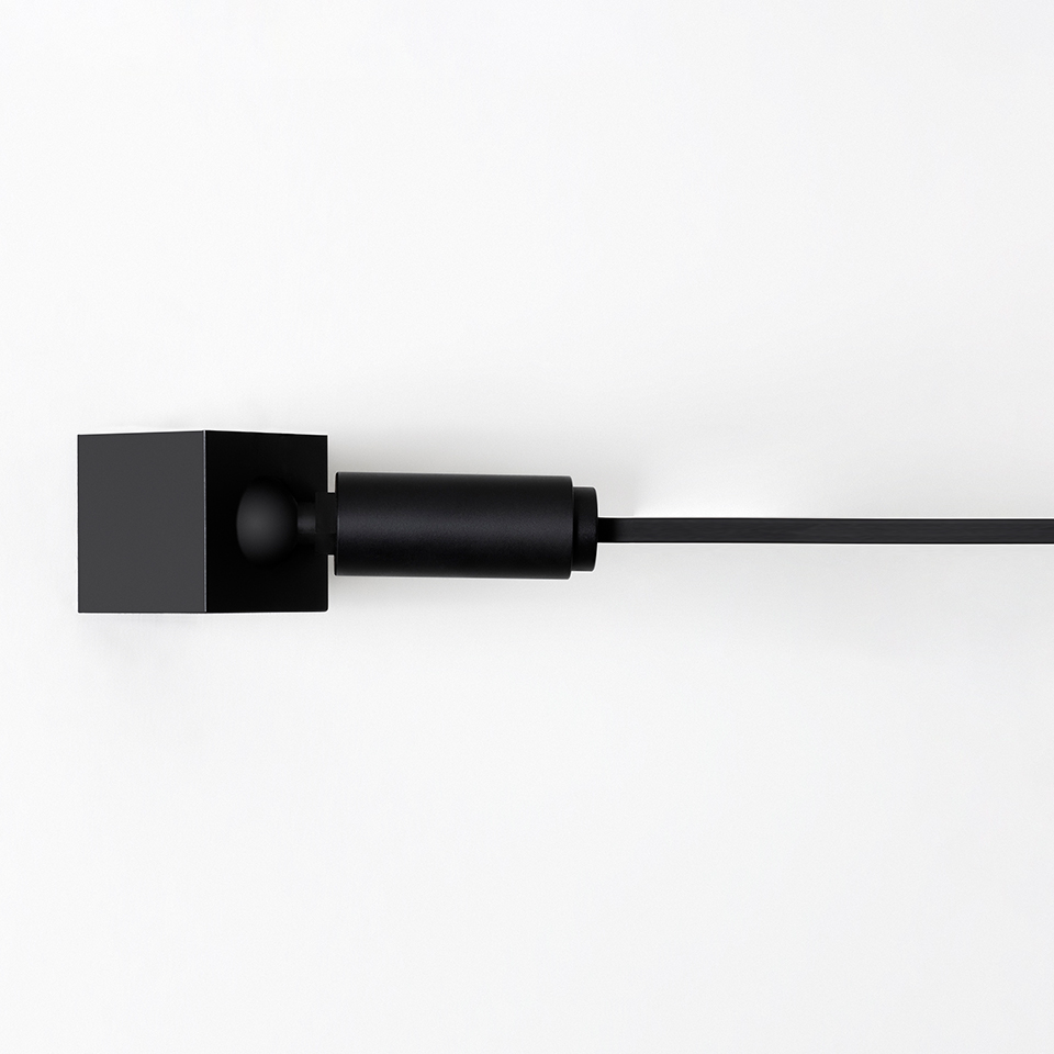 Artemide Funivia wall mount detail: matte black square canopy with cylindrical joint and slim horizontal rod extending outward