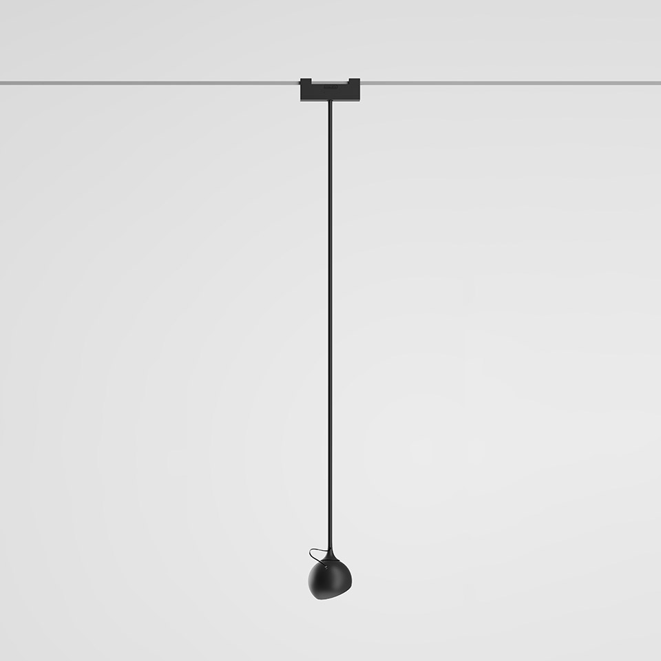 Artemide Funivia pendant lamp: matte black teardrop-shaped head suspended on a long thin black cable from a ceiling track mount
