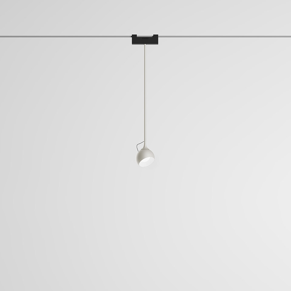 Artemide Funivia pendant lamp: white spherical shade suspended on a thin wire from a black track-mounted ceiling adapter