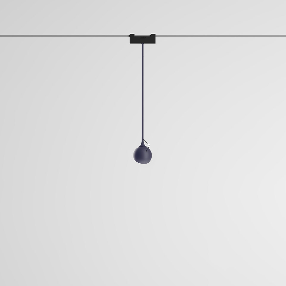 Artemide Funivia pendant lamp: dark blue spherical shade suspended from a black cable on a ceiling track system