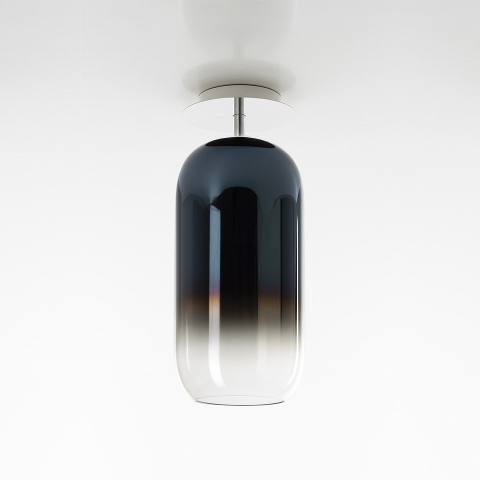 Artemide Gople ceiling lamp with pill-shaped blown glass shade, gradient from dark blue-black top to clear bottom, chrome mount