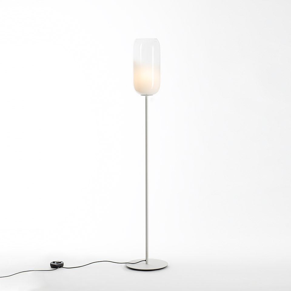 Artemide Gople floor lamp with tall white metal stem, round base, and elongated blown glass diffuser shading from clear to white - 2