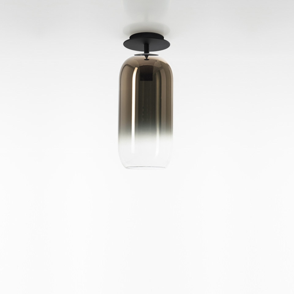 Artemide Gople ceiling lamp with elongated capsule-shaped glass shade, bronze-to-clear gradient, black metal canopy