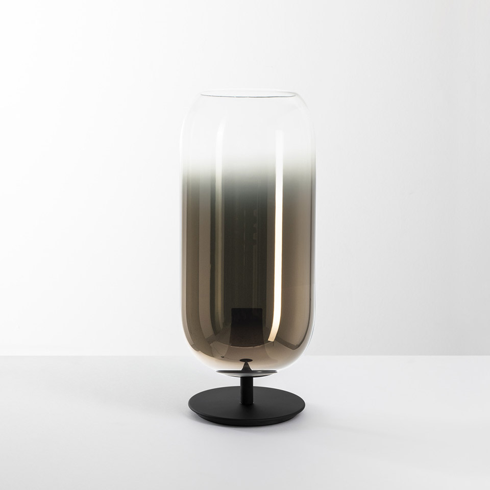 Artemide Gople table lamp: tall capsule-shaped smoked glass diffuser with gradient effect on a round black metal base