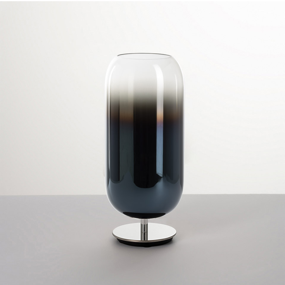 Artemide Gople table lamp: capsule-shaped blown glass shade with dark-to-clear gradient, on a polished chrome base