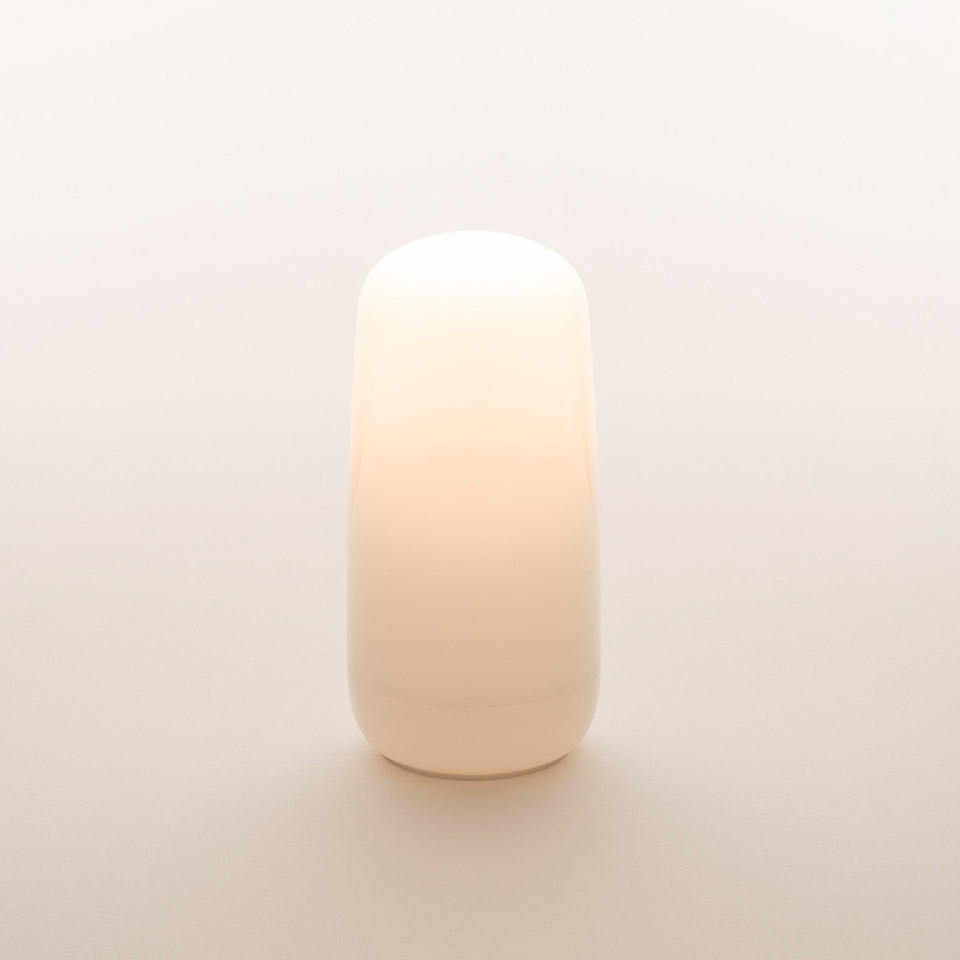 Artemide Gople Portable lamp: compact opal white blown glass diffuser with rounded top and base, emitting warm soft light
