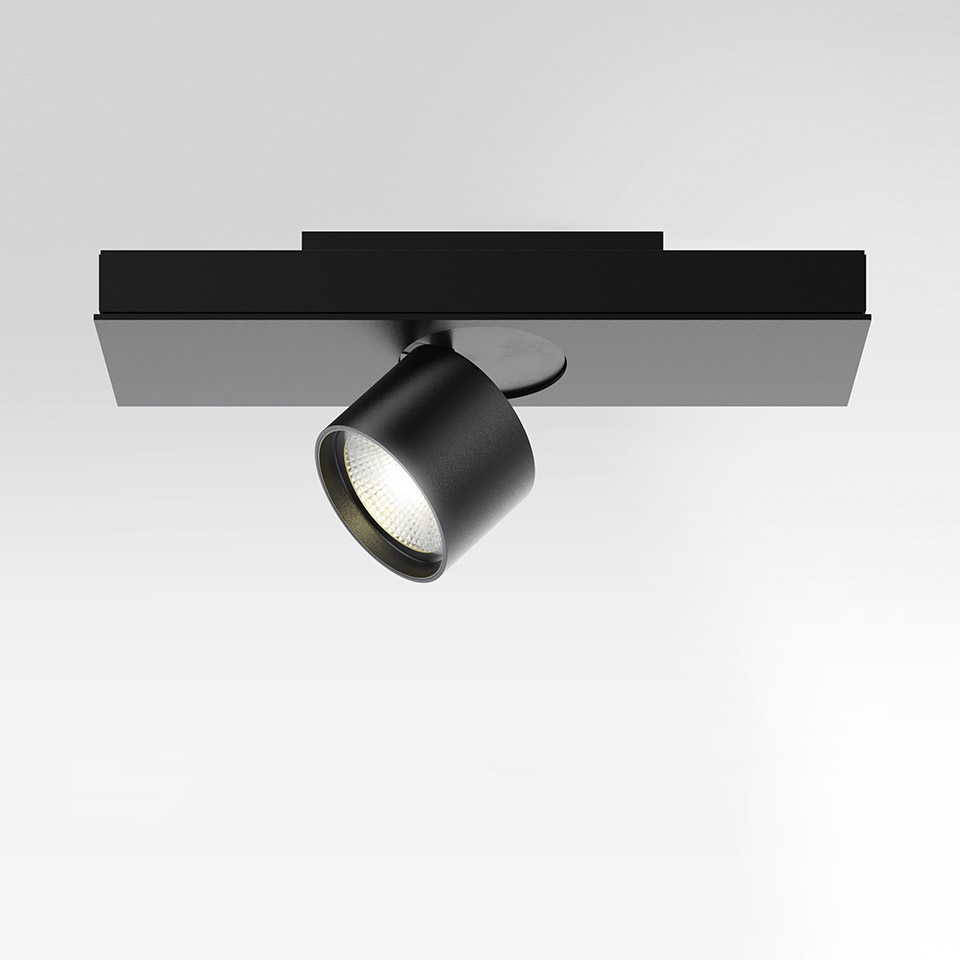 Artemide Hoy System: black adjustable single-head LED spotlight mounted on a rectangular magnetic track, tilted downward