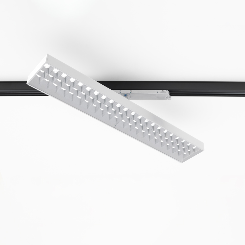 Artemide Hoy Refractive 3-Phase Track: white rectangular LED fixture with refractive grid, mounted at an angle on a black track rail