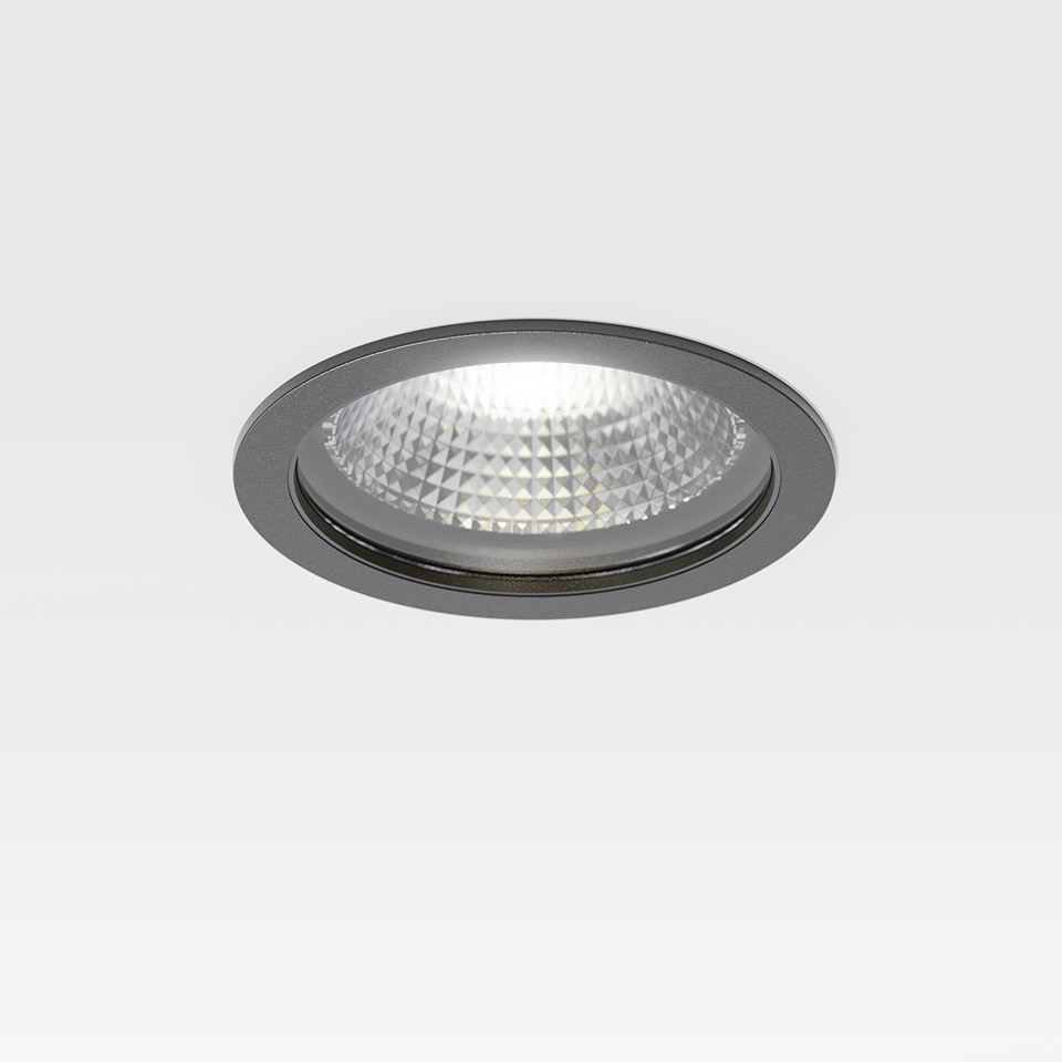 Artemide Hoy Spot recessed LED downlight with dark grey circular trim and faceted crystal lens diffuser