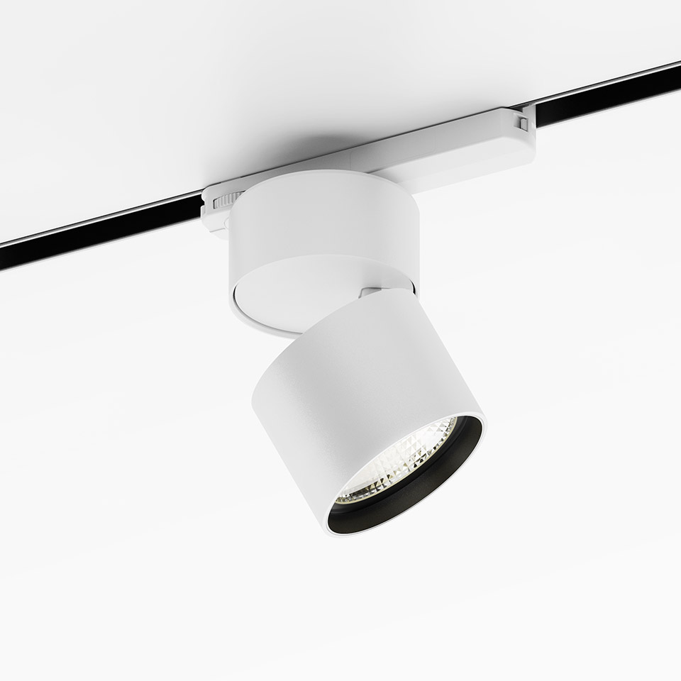 Artemide Hoy Spot on 3-Phase Track: white cylindrical LED spotlight, tiltable head, mounted on black rail system