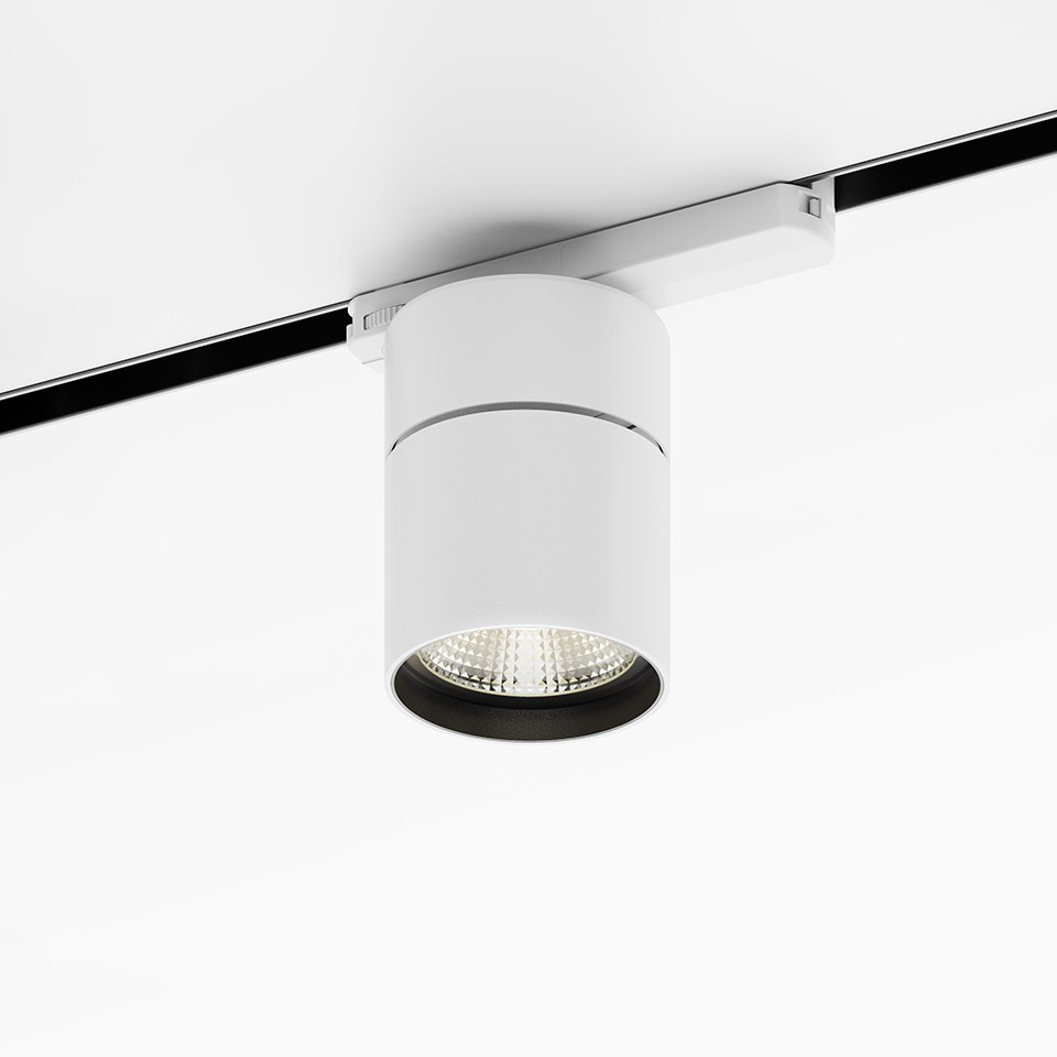 Artemide Hoy Spot 3-Phase Track: white cylindrical LED spotlight mounted on black track rail, with dark interior reflector - 2