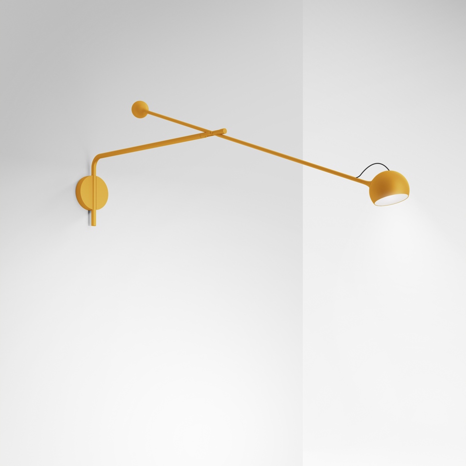 Artemide Ixa wall lamp in mustard yellow, featuring a long adjustable double arm with a small rotating bowl-shaped head