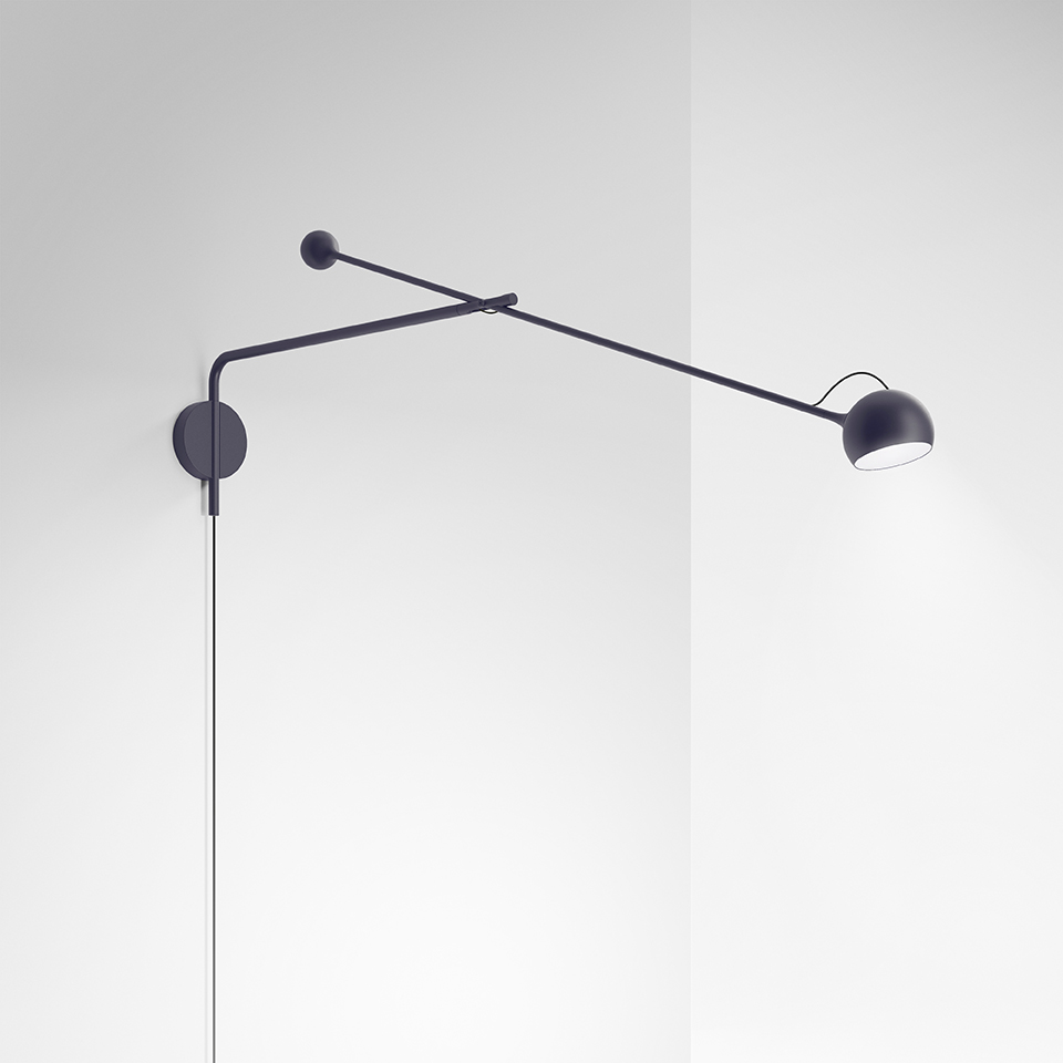 Artemide Ixa wall lamp in black, featuring a long adjustable arm with small counterweight and a compact directional LED head