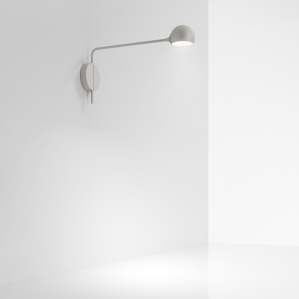 Artemide Ixa wall lamp in white, featuring a slender arm extending from wall mount with adjustable spherical LED head