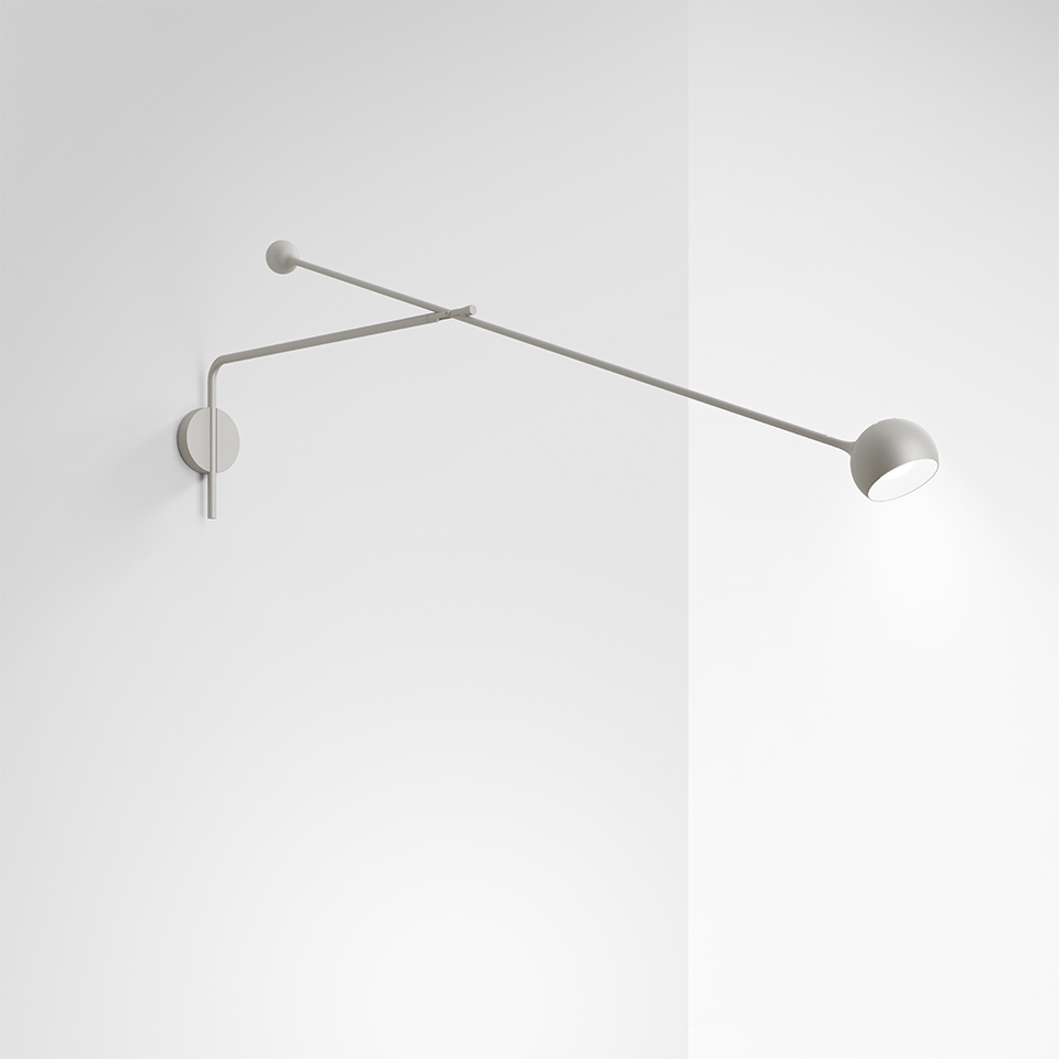 Artemide Ixa wall lamp in grey, featuring two slim articulated arms with a small directional LED head, mounted on a wall corner
