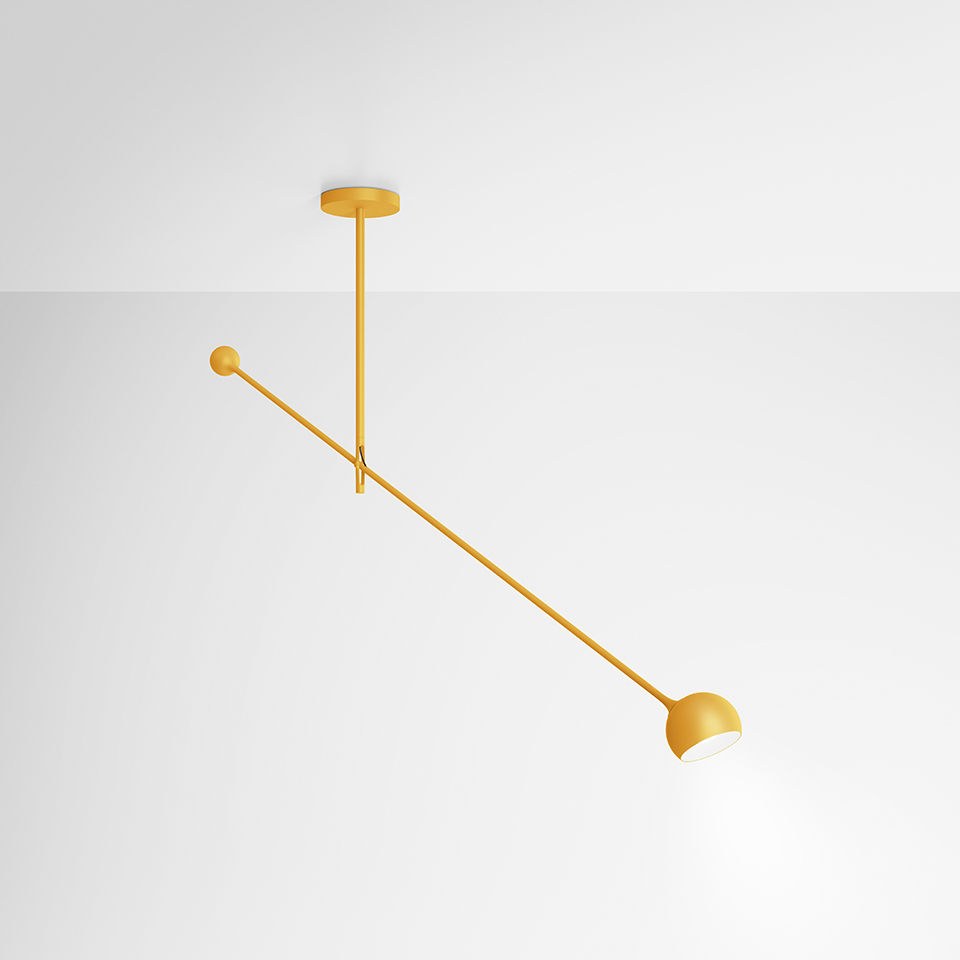 Artemide Ixa ceiling lamp in mustard yellow: long diagonal arm with dome shade on one end and decorative ball on the other